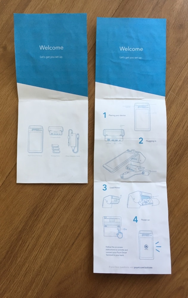 The printed guide, closed and opened to the illustrated steps