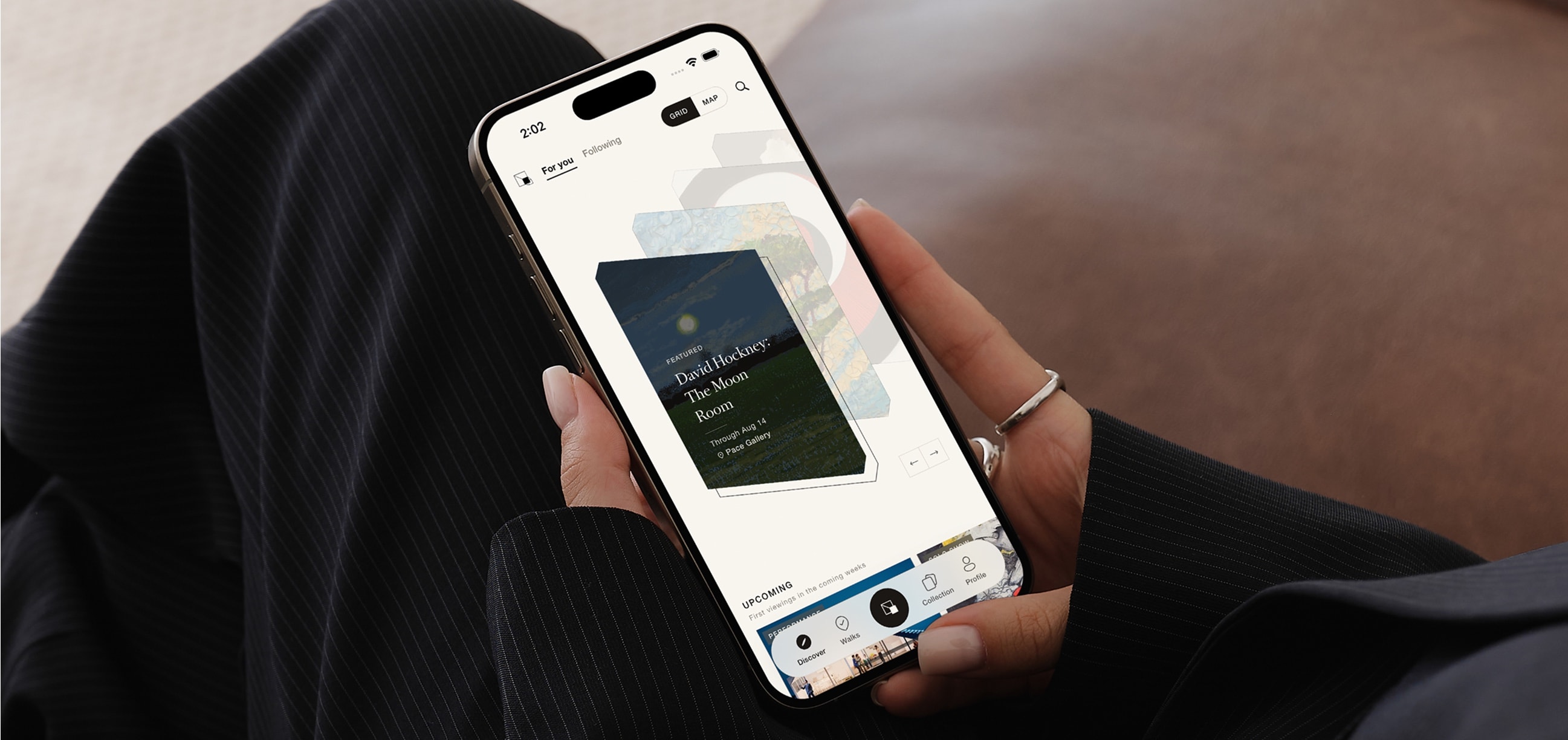 Praxima Compass running on an iPhone held in one hand